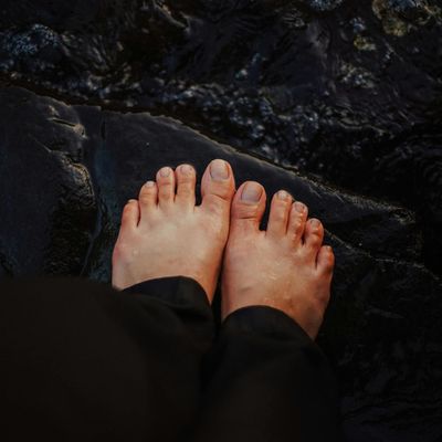 Close-up on a person's feet, showing stability on the ground.