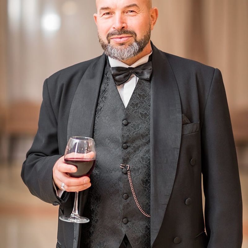 Man performing a plank with perfect form in a dark room.
